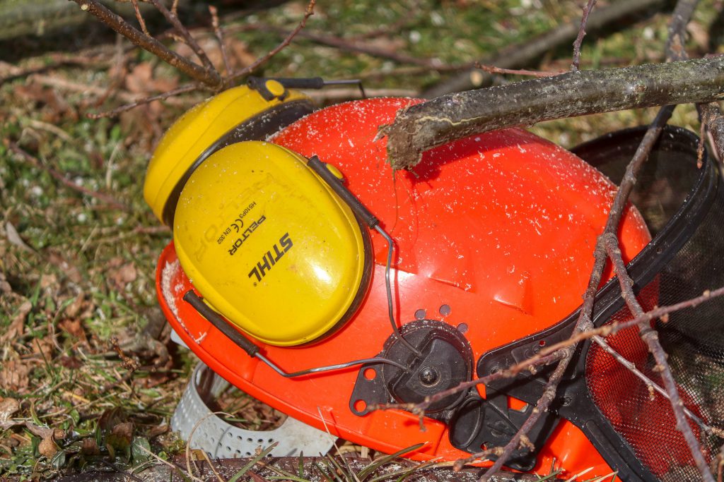 Protection helm with ear muffs lying on the ground. The Effects of Untreated Hearing Loss