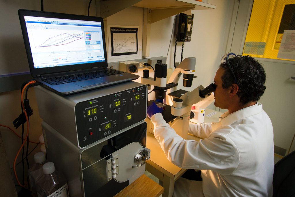 Can Hearing Loss be Inherited? Scientist looking at the microscope.