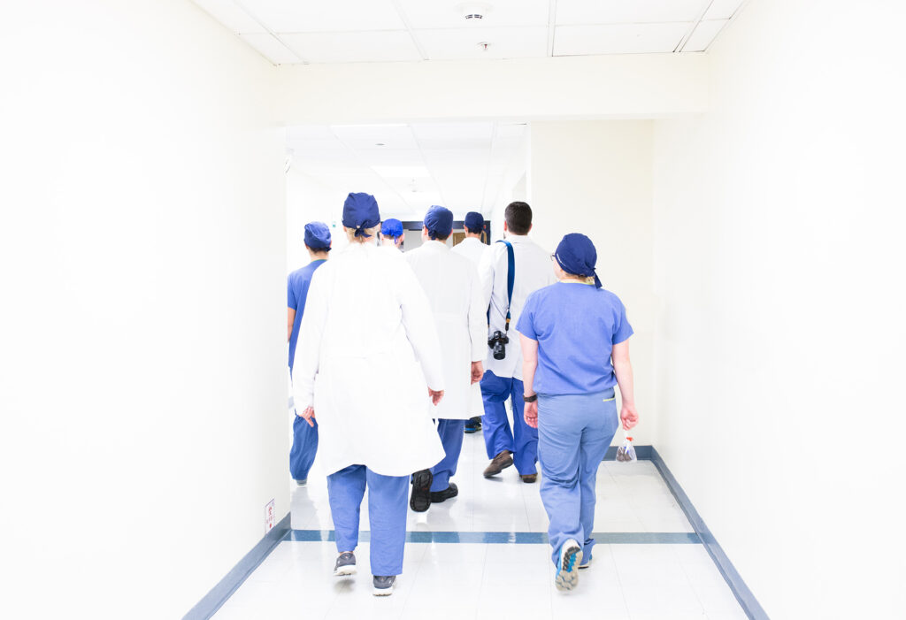 Hearing Loss - Diagnosis. Doctors walking down the hall