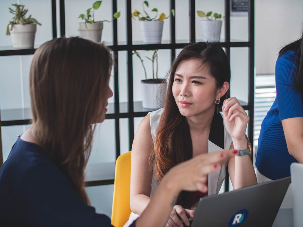 Two women talking. Talking to Someone with Hearing Loss